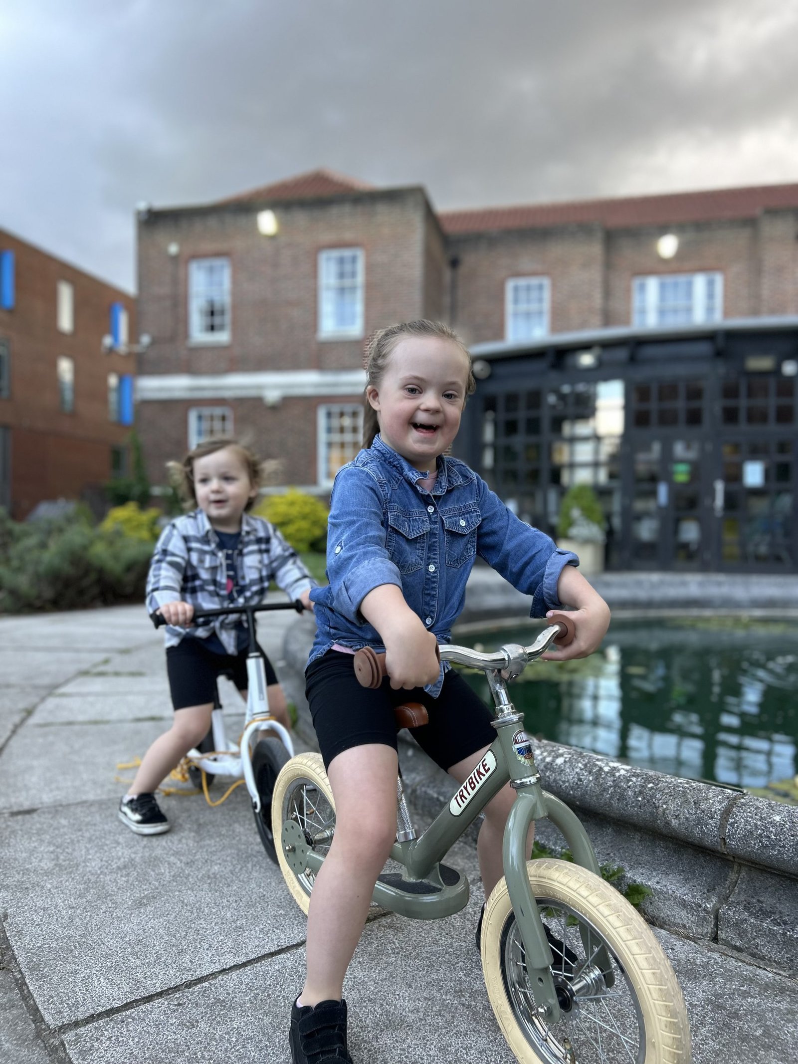 A girl on a balance bike