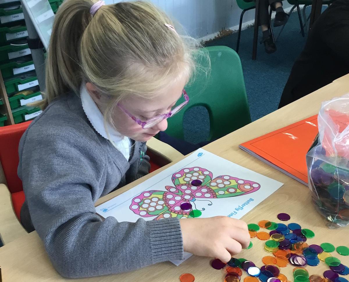 Girl at school counting