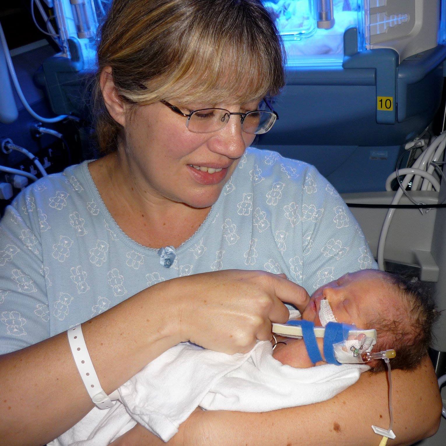 Woman holding baby in arms