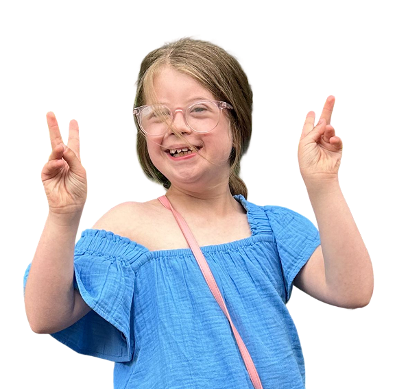 A girl in a blue dress making peace signs and beaming at the camera