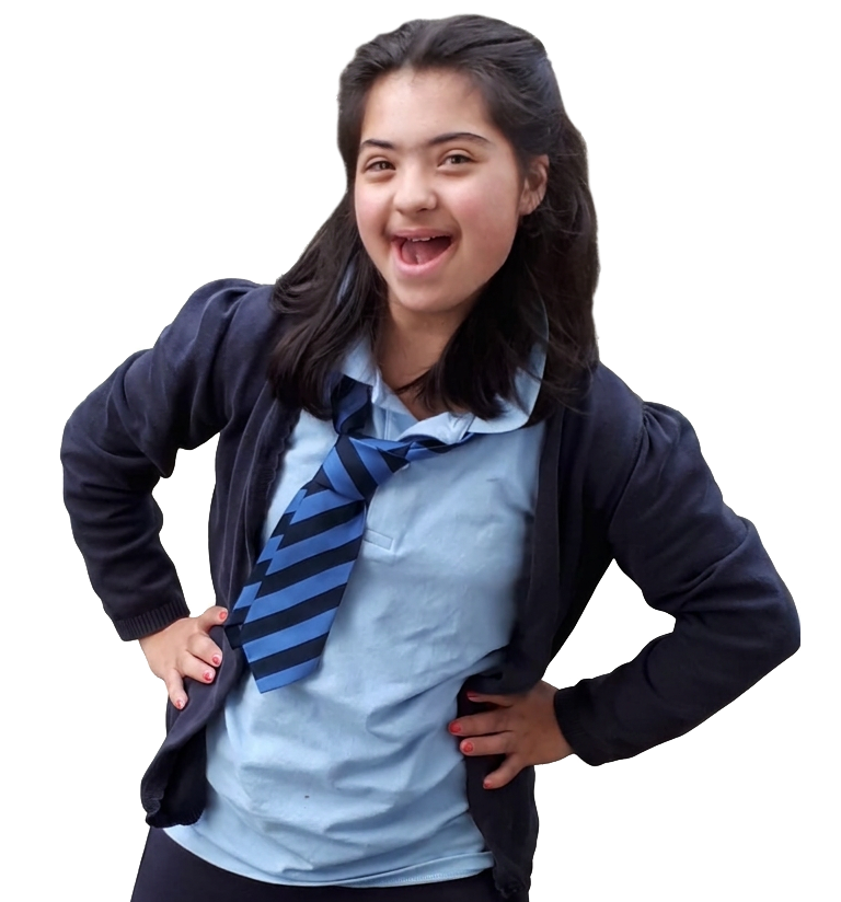Girl smiling with hands on hips in school uniform